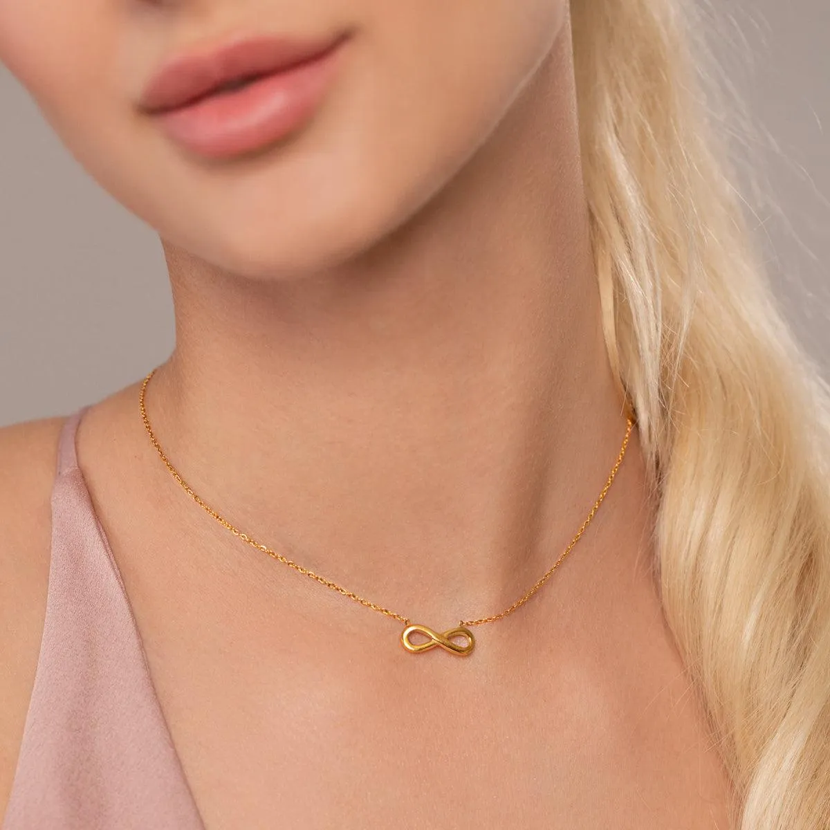 Keira Infinity Symbol Pendant Necklace In Gold-Tone