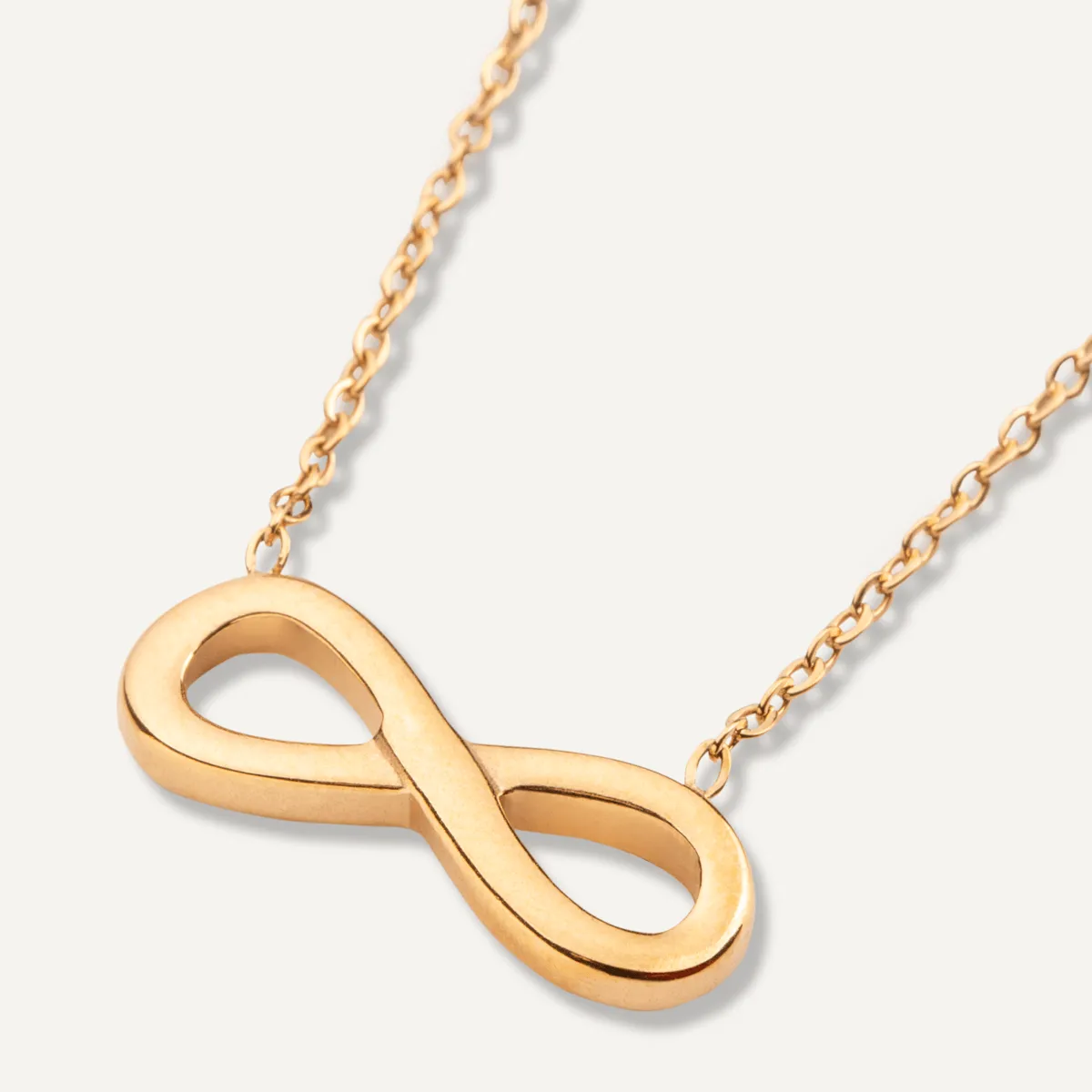 Keira Infinity Symbol Pendant Necklace In Gold-Tone