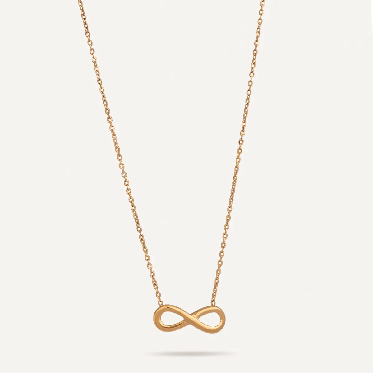 Keira Infinity Symbol Pendant Necklace In Gold-Tone